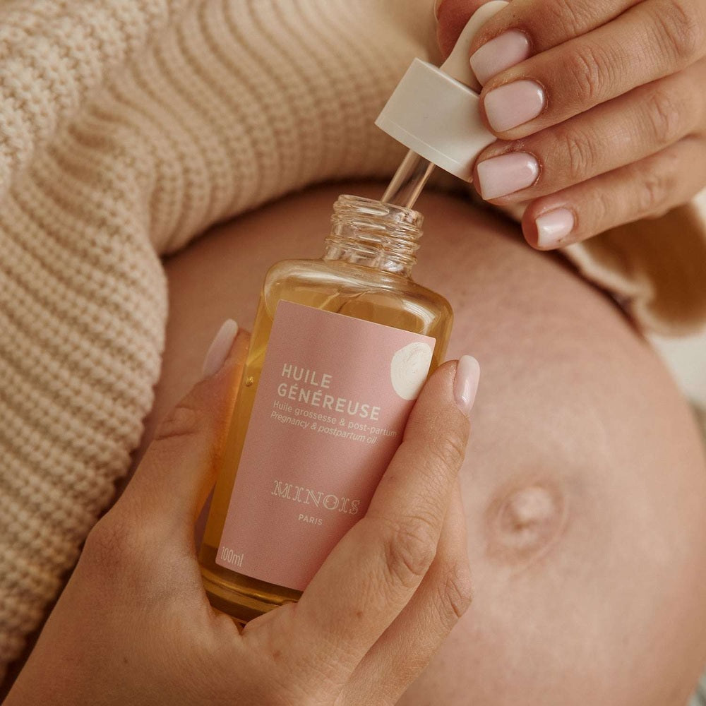 Minois Paris Pregnancy and Post-Partum Oil, 100 ml in a pink-labeled bottle with dropper