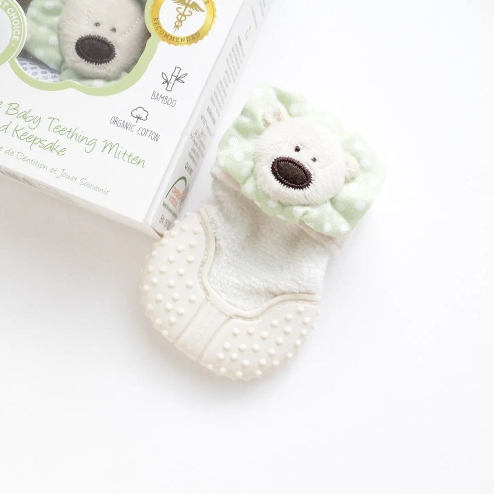 Mitteez Organic Developmental Teething Mitten, white plush with mint polka-dot cuff and textured grip dots.