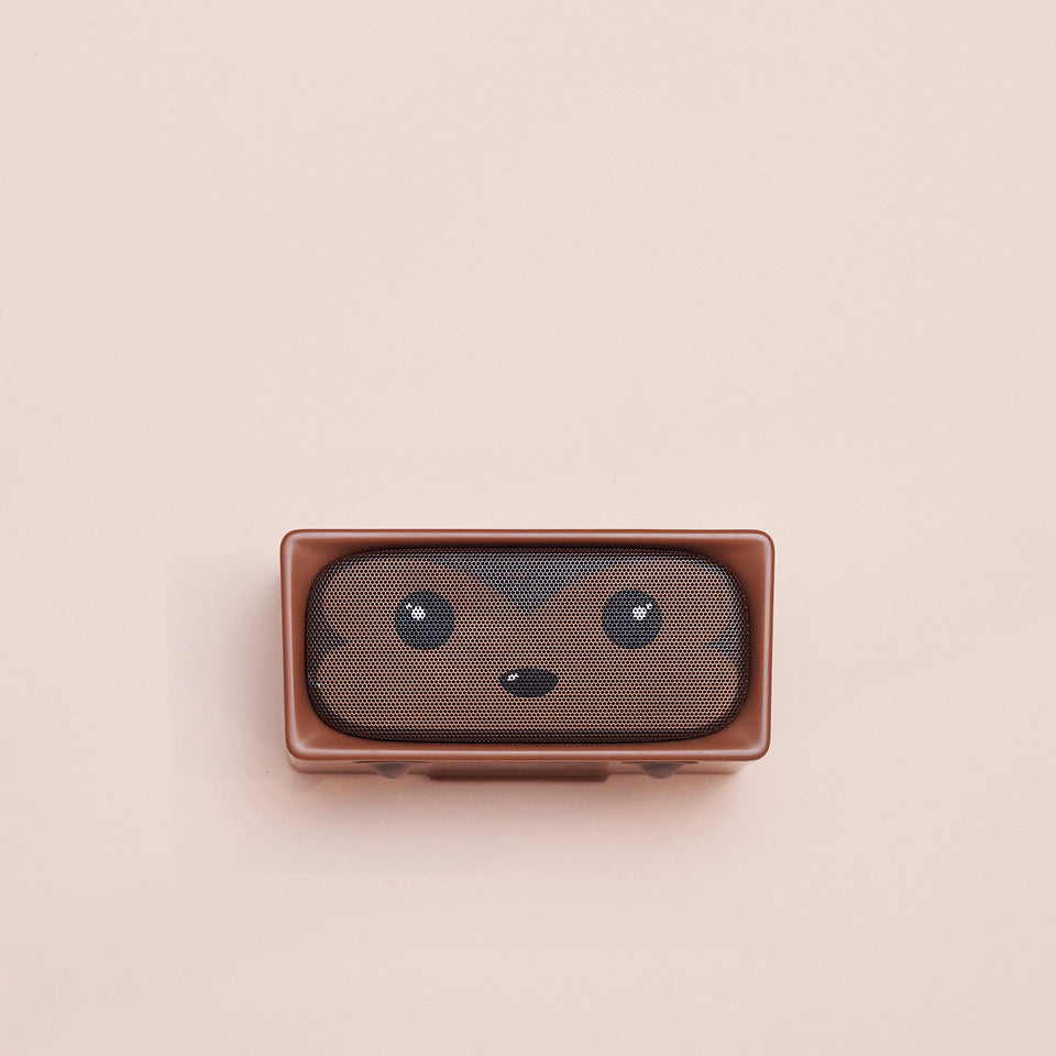 MOB Adorable Speaker-Monkey brown speaker with mesh grille forming a friendly monkey face