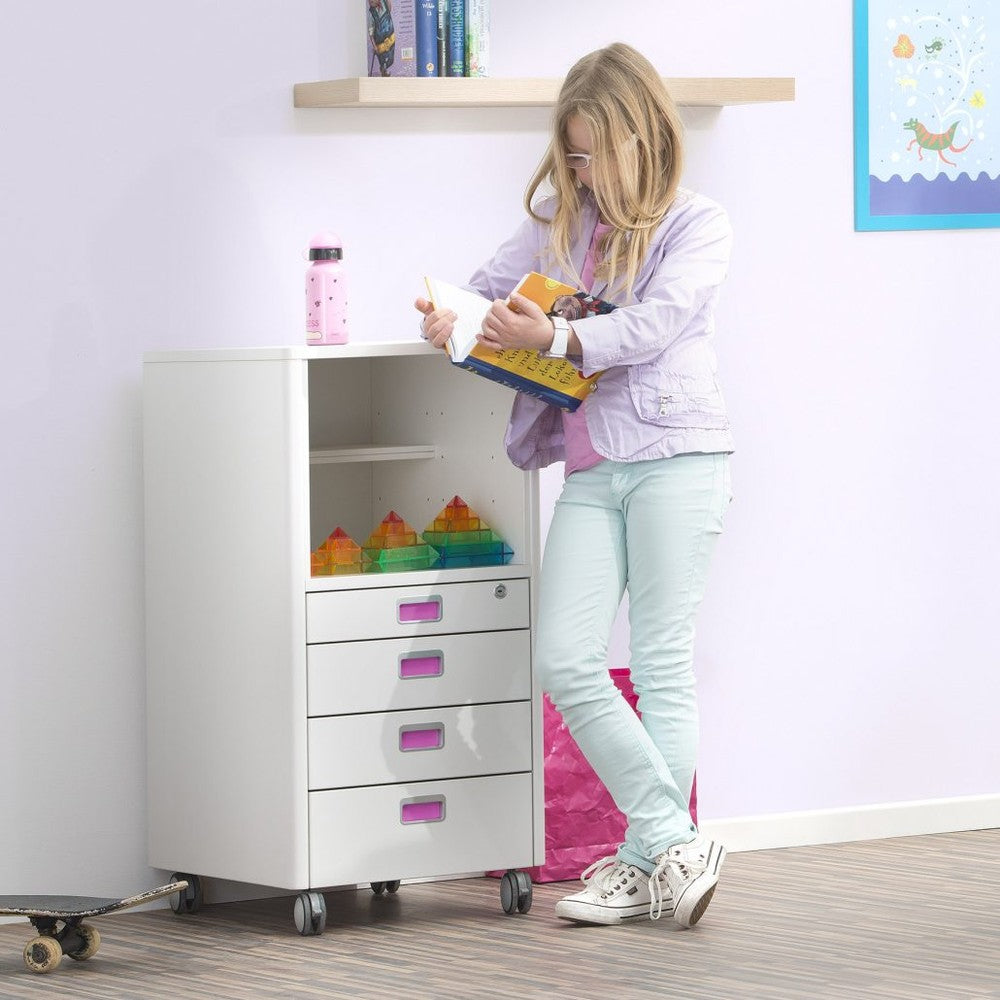 Moll Champion Cubicmax baby dresser on wheels with pink drawer handles; rainbow pyramid toys on open shelf