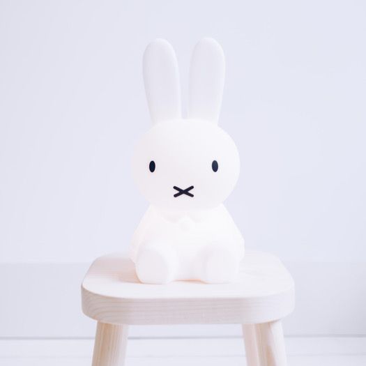 Mr Maria First Light Miffy night light, white bunny on a natural wooden stool.