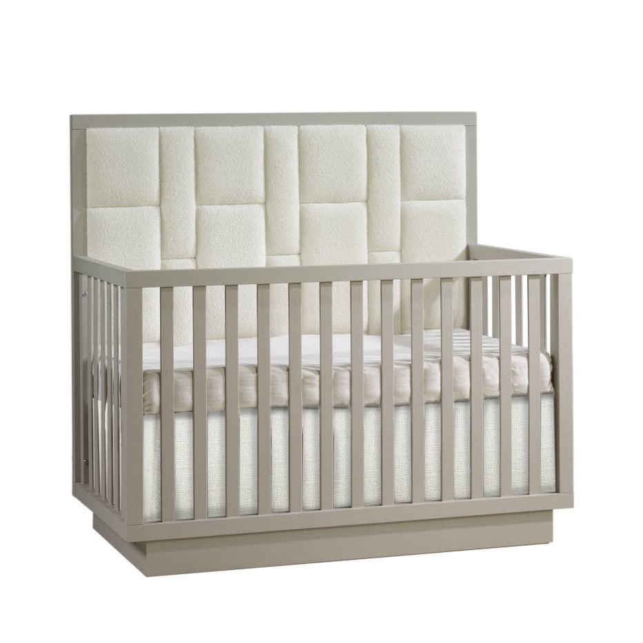Natart Signature Series Como 4-in-1 Convertible Crib with geometric upholstered panel in light gray finish.