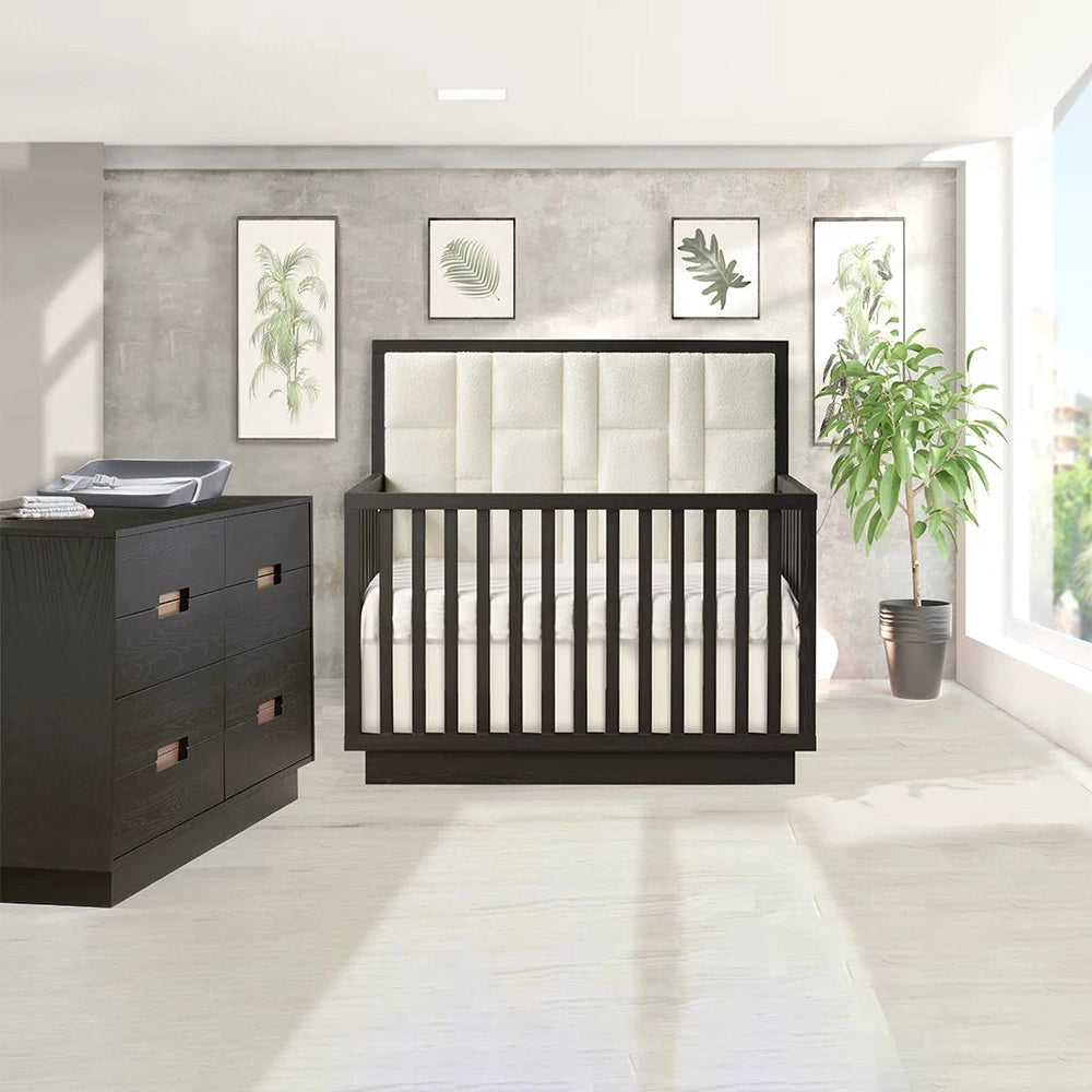 Natart Signature Series Como 8-Drawer King Dresser in dark espresso, positioned beside a crib in a bright