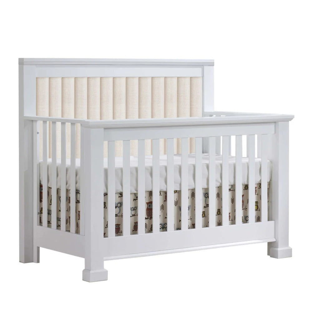 NATART Taylor 5-in-1 Convertible Crib in white wood with channel tufted headboard