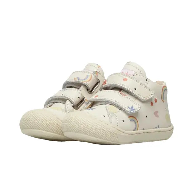 Naturino Cocoon Vl Cream toddler sneakers; cream with rainbow print and two Velcro straps fastened for secure fit.
