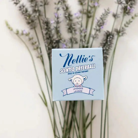 Nellie's Scented Dryerball in lavender scent, displayed with blue packaging in front of lavender stems.