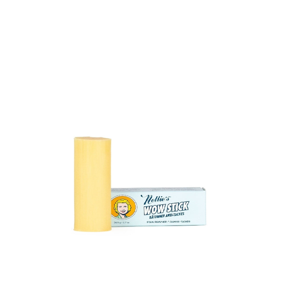 Nellie's Wow Stick Stain Remover stick stands upright beside a light-blue box, showing a yellow solid.