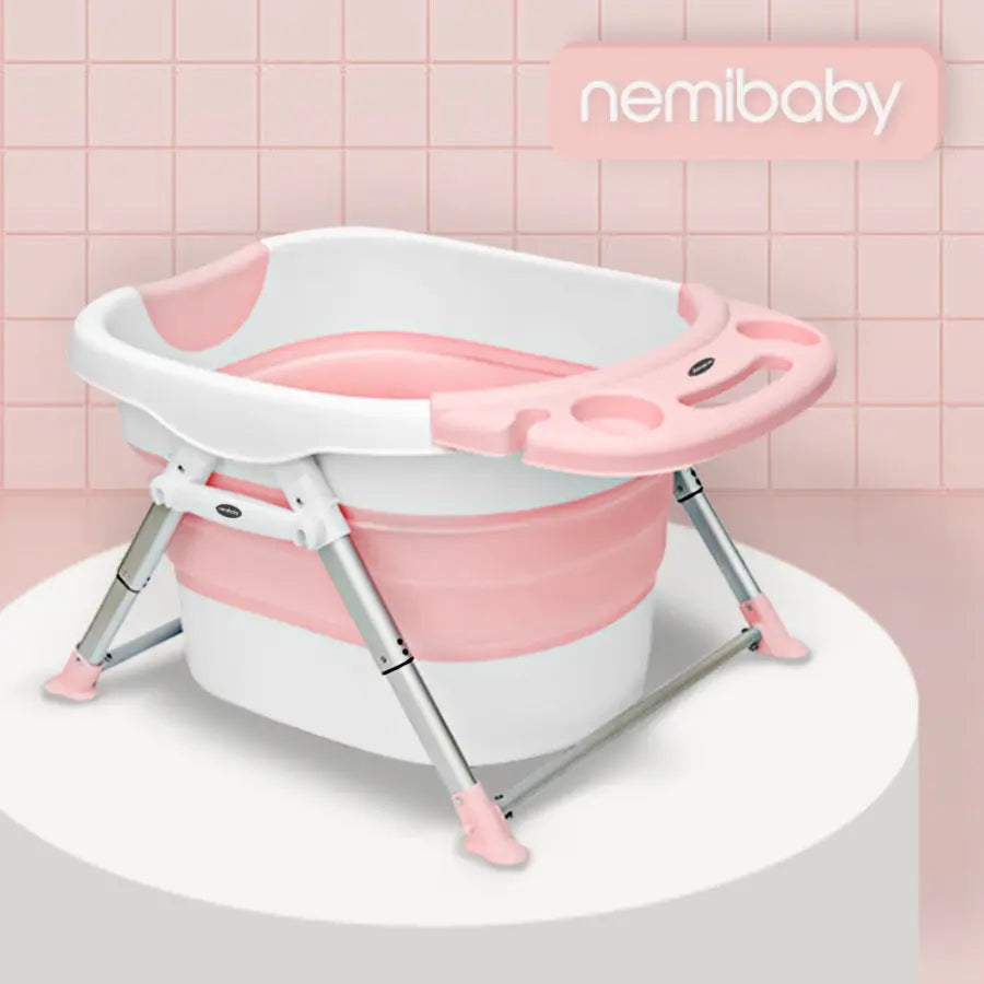Nemibaby Foldable 4-in-1 Baby Bathtub on a metal stand with pink tub, legs extended for stability.
