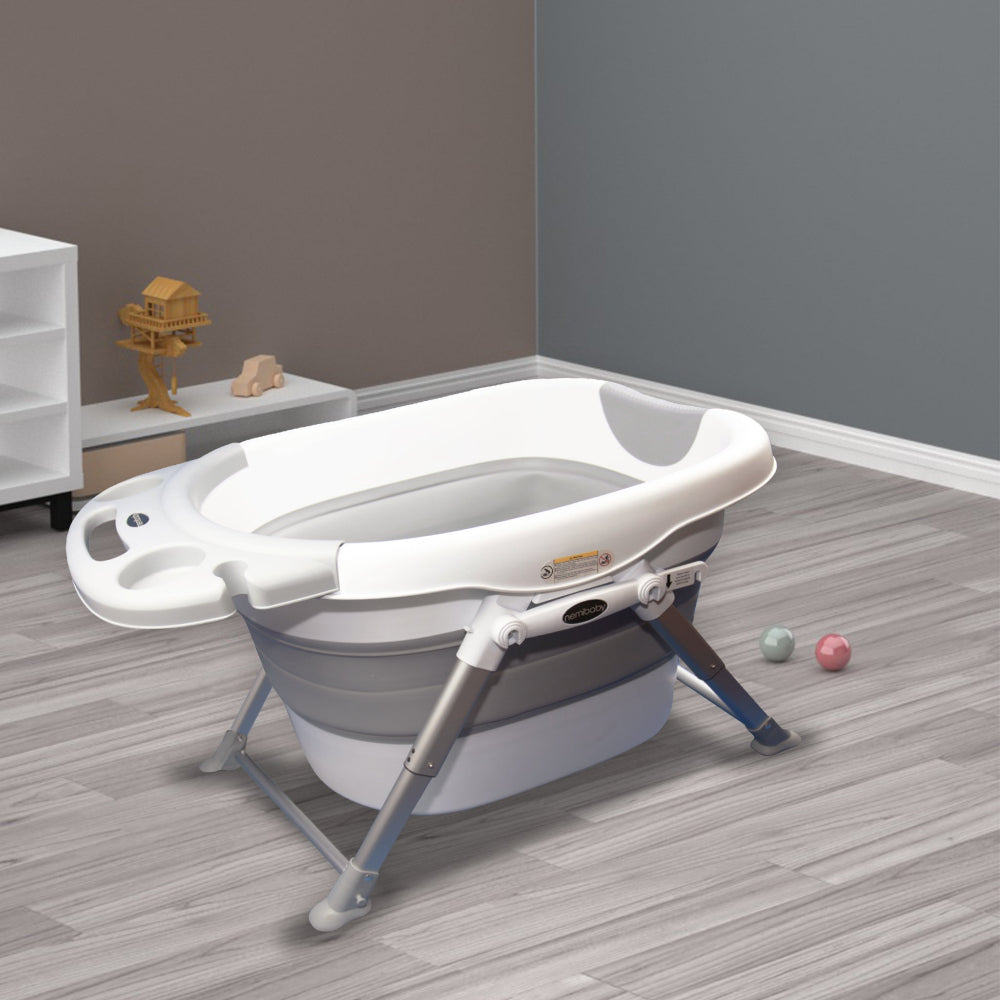 Nemibaby foldable baby/toddler bathtub in gray with white rim and metal frame.
