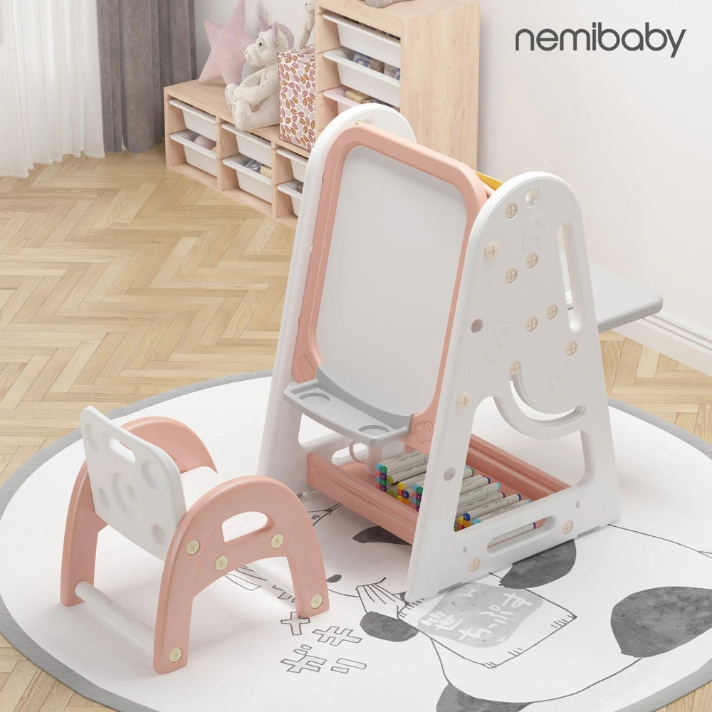 Nemibaby Multi Function Easel & Bookshelf in pink and white, with built-in storage shelves and a matching stool ready for art.
