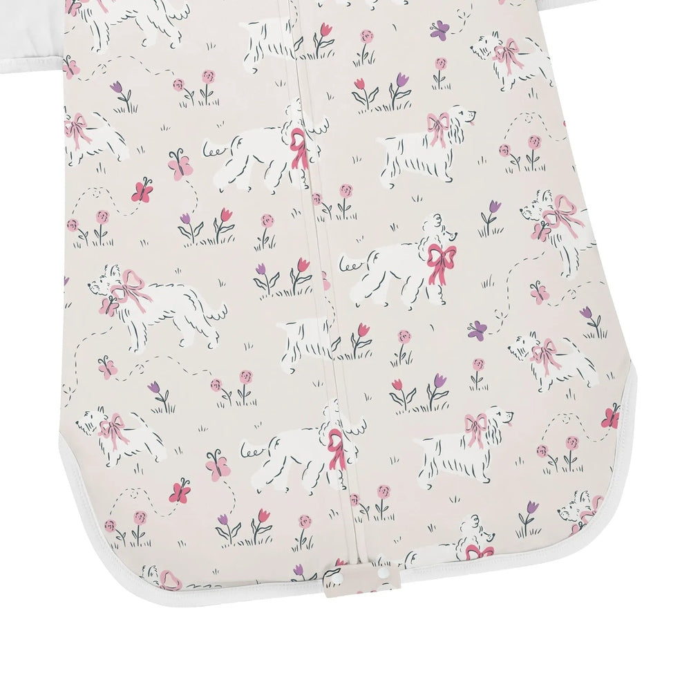 NEST DESIGNS Nest Designs 1.0 TOG Swaddle Sleep Bag Doggie Meadow sketch-style dogs with pink bows and butterfly print img 6/6