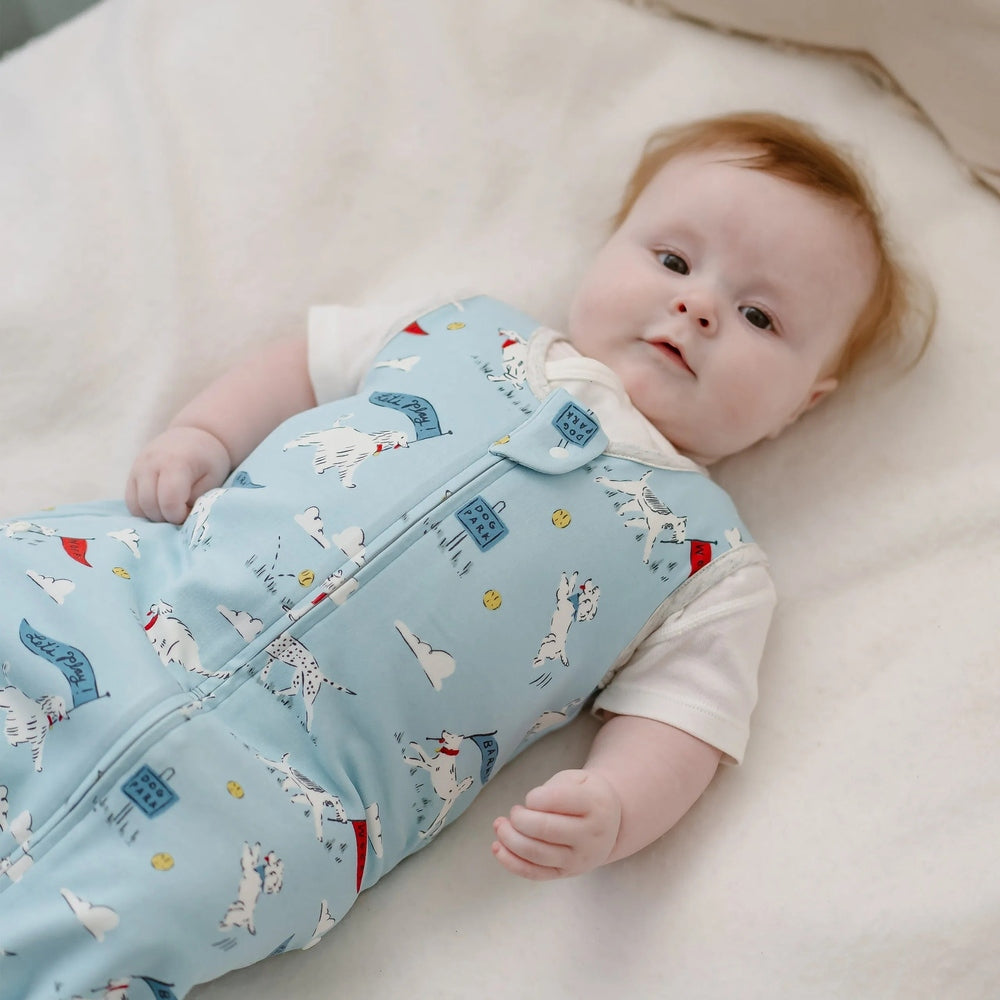 NEST DESIGNS Nest Designs 1.0 TOG Swaddle Sleep Bag Puppy Park front zipper closure with white trim at sleeves and neck img 3/6