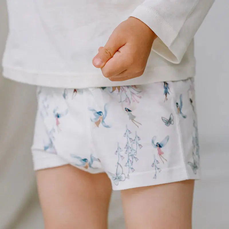 Nest Designs Bamboo Boys Boxer Briefs Underwear Meadow Mystery 2-pack, white with floral butterfly print, on a child.