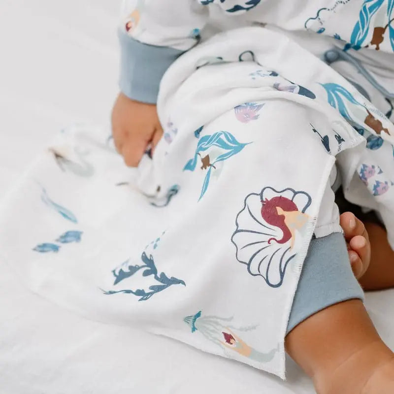 Nest Designs Bamboo Bubs Baby Washcloth Set (6 Pack) white with blue sea life print, baby wrapped in washcloth during bath