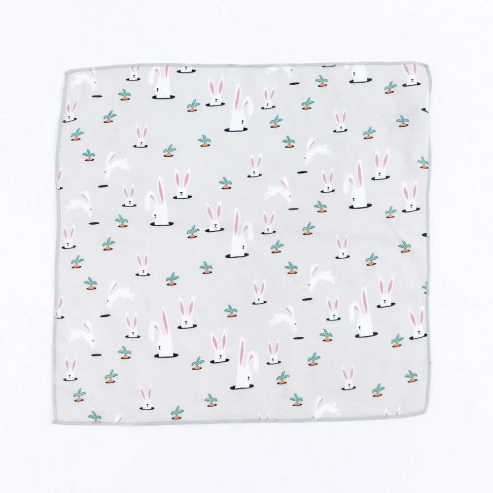 Nest Designs Bamboo Bubs Baby Washcloth Set (6 Pack) folded flat on gray fabric with bunny pattern and pastel accents.