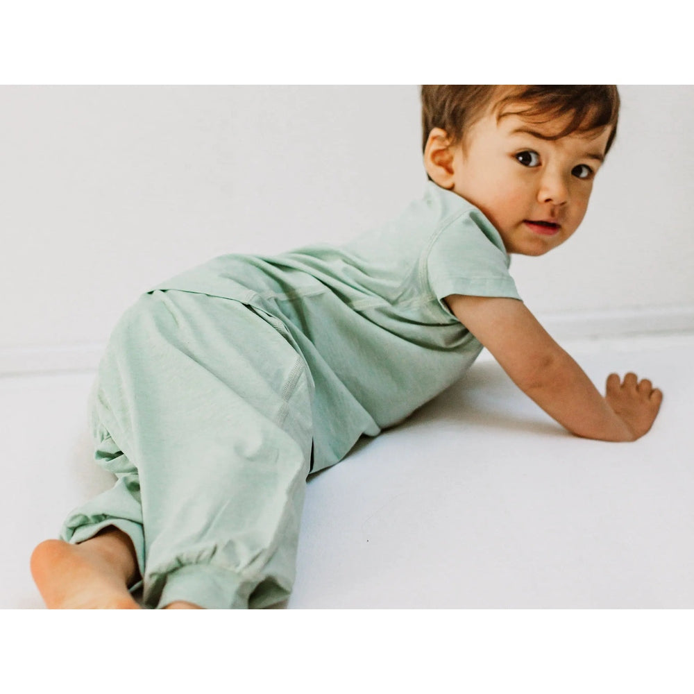 Nest Designs Bamboo Jersey Harem Pants Harbor Grey; baby crawls in soft, relaxed-fit pants.
