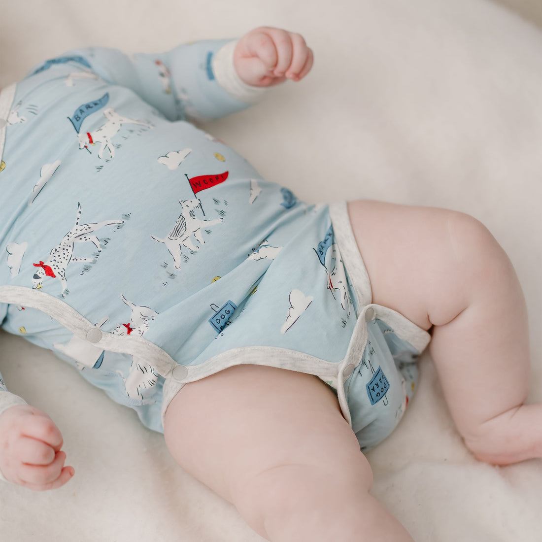 Puppy Park Long Sleeve Onesie bottom snap opening worn by baby