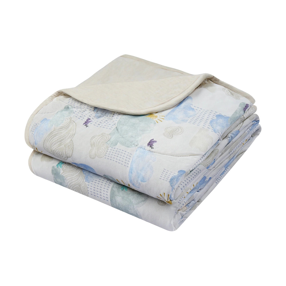 NEST DESIGNS Nest Designs Bamboo Jersey Quilted Cozy Blanket Fluffy Puffs reversible with solid backing and whale-patterned quilted img 1/6