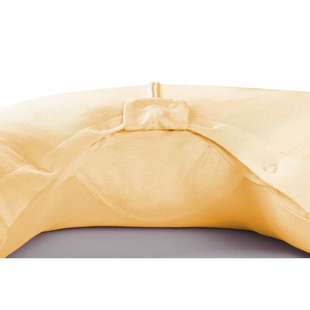 Nest Designs bamboo jersey short-sleeve footed sleep bag, 0.5 tog, Pantone Sunset Gold, with snap closures.