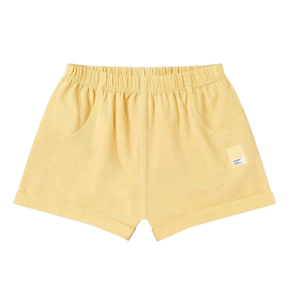 Nest Designs Bamboo Jersey Shorts Pantone Sunset Gold, soft yellow fabric with elastic waist and front pockets.