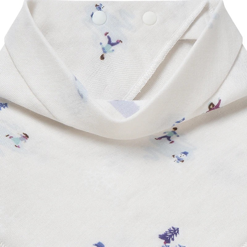 Nest Designs Bamboo Muslin Baby Bandana Bib Frosty Fun, white with tiny prints, fastened at the neck.