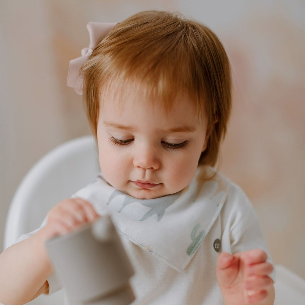 Nest Designs Pony Express Bamboo Muslin Baby Bandana Bib in White with Pale Gray Print