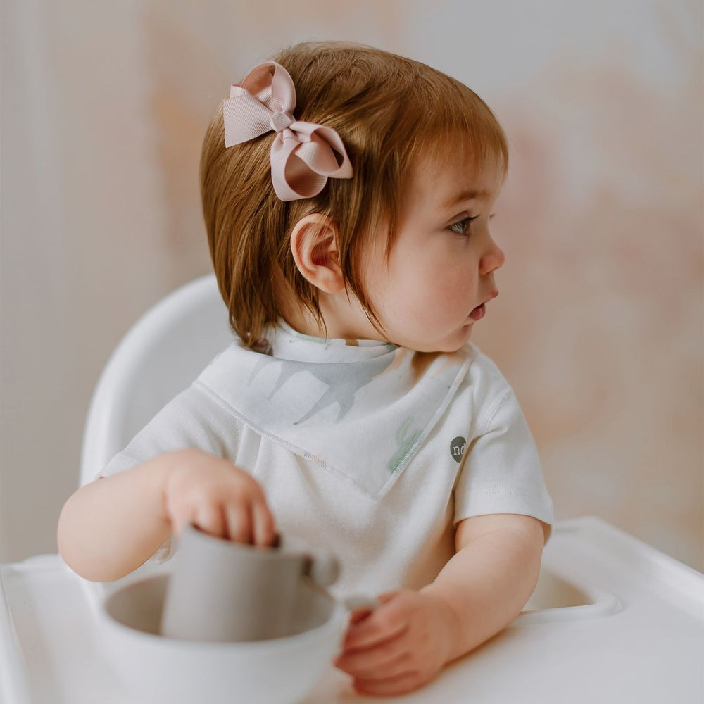Nest Designs Pony Express Bandana Bib in White with subtle mint pattern