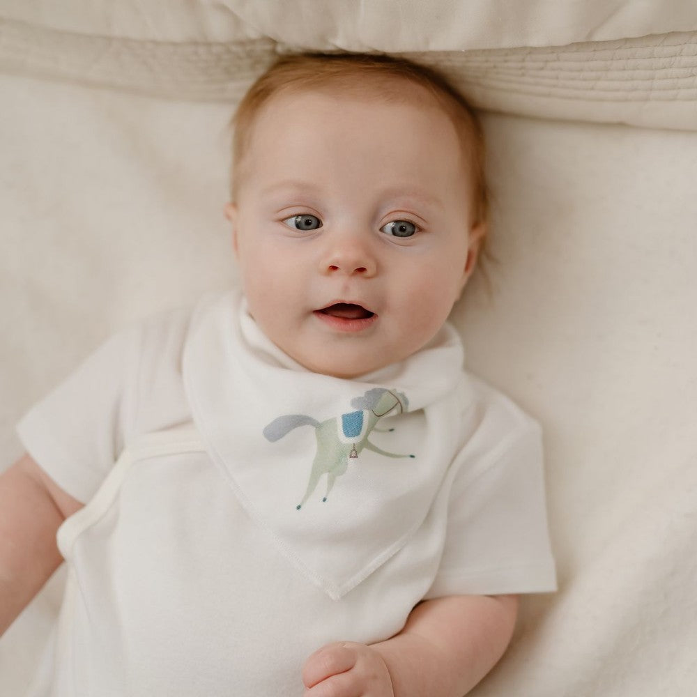 Nest Designs Pony Express Bandana Bib in White Bamboo Muslin with pastel pony graphic