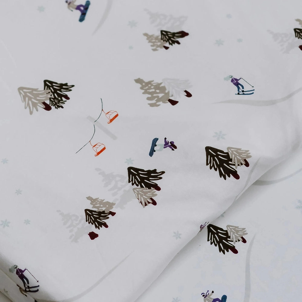 Nest Designs Bamboo Toddler Pillow With Pillowcase in White with Multicolor Winter Trees, Skiers and Snowflakes Pattern