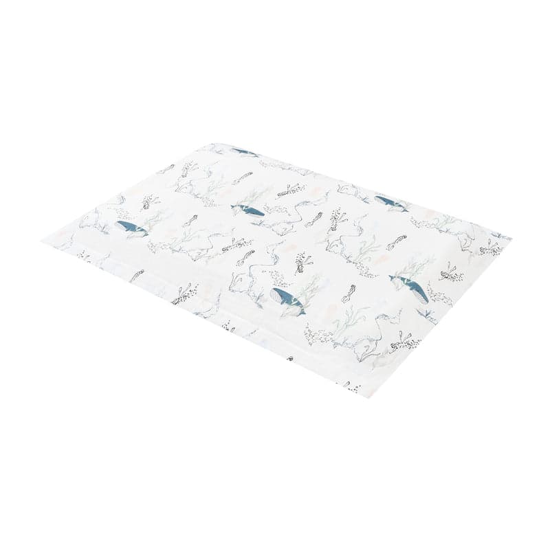 Nest Designs Bamboo Toddler Pillowcase Whale, white fabric with blue whales and seaweed, laid flat.