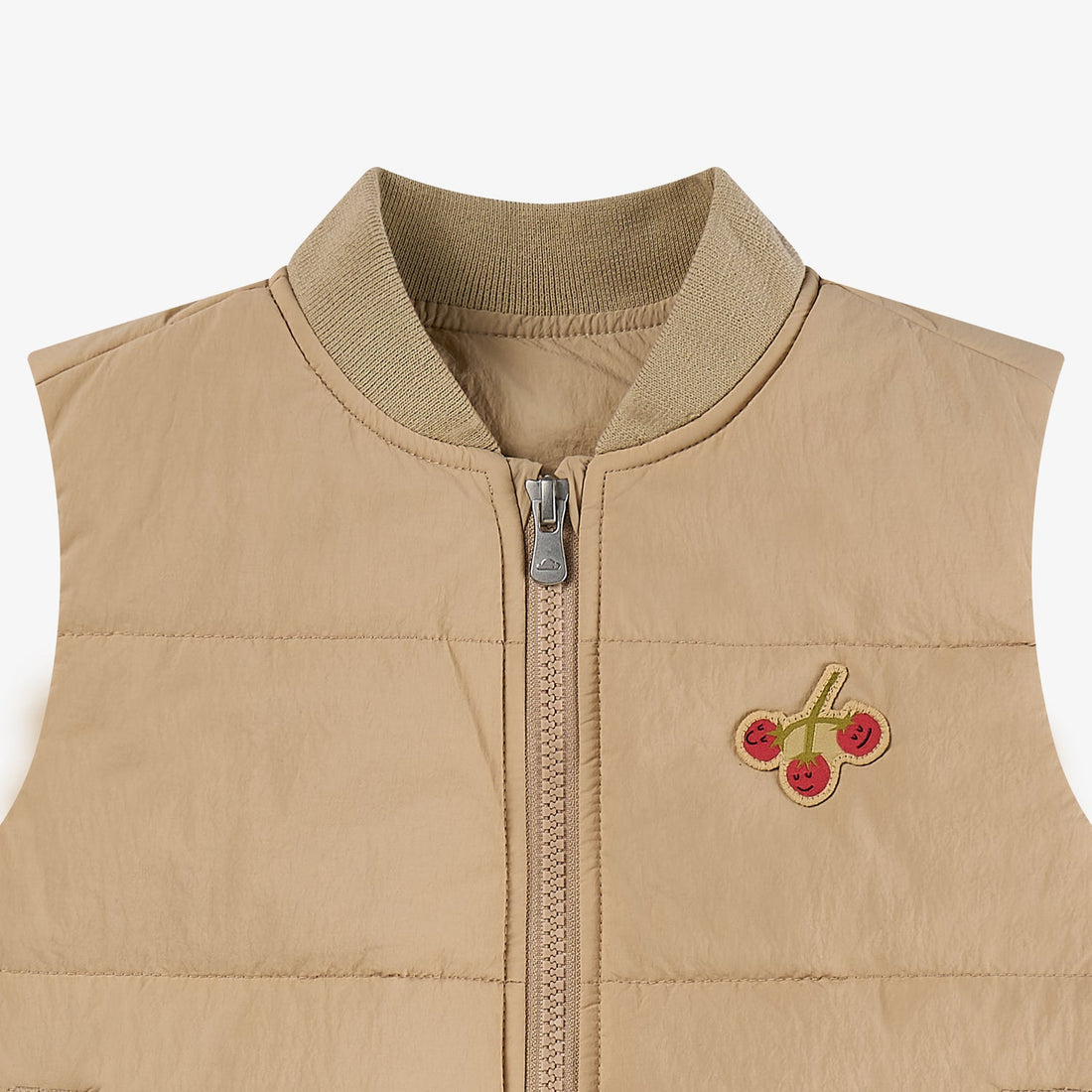 Nest Designs Toast Biscuits & Vine Puffer Vest neckline detail with ribbed collar, padded panels and red cherry embroidery