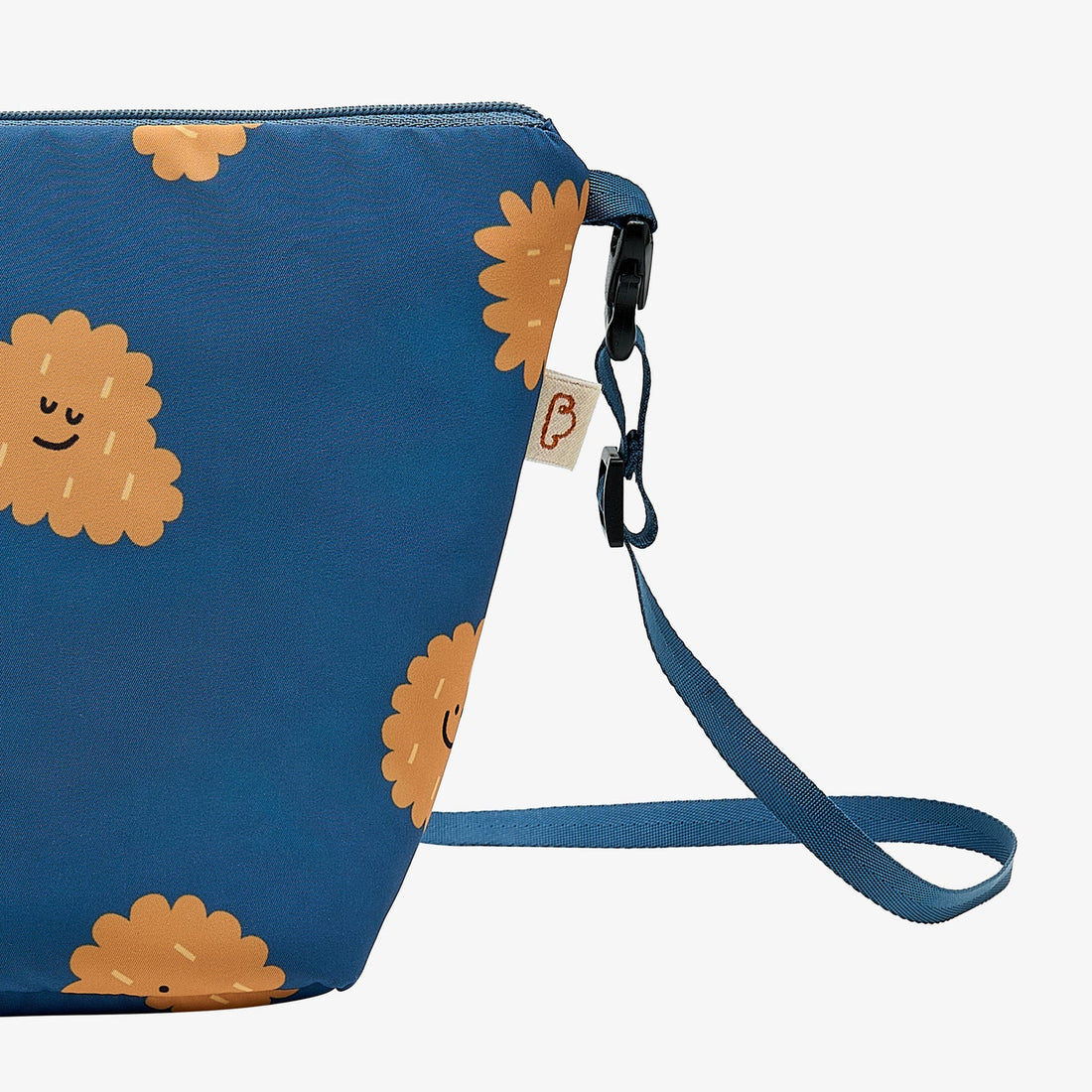 Nest Designs Biscuits and Vine waterproof bag in Biscuit Banter navy, side studio view with black clip and curved strap