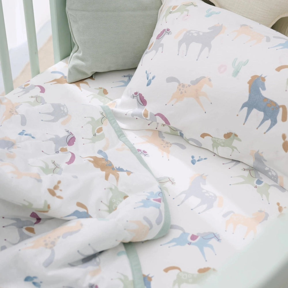 Nest Designs Bamboo Jersey Nook Quilted Cozy Blanket in Pony Express pastel horse print