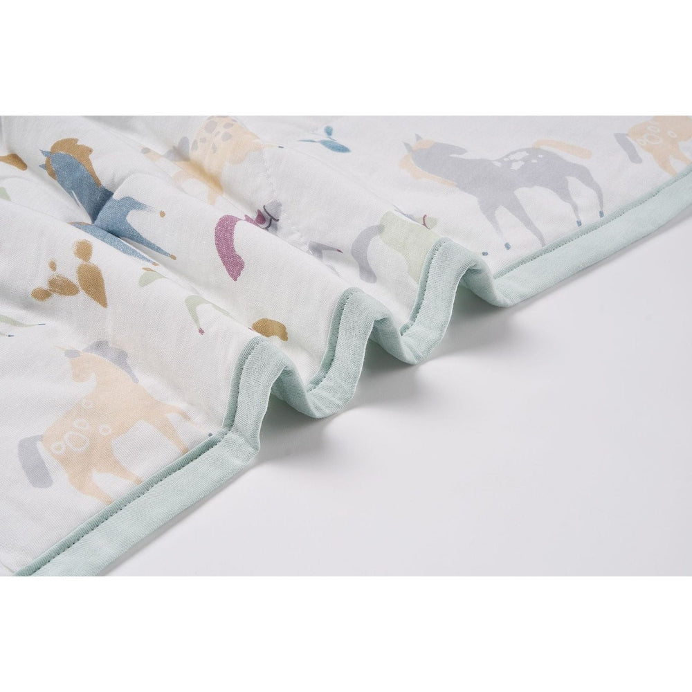 Nest Designs Cozy Blanket Small Pony Express in pastel pony print with mint trim