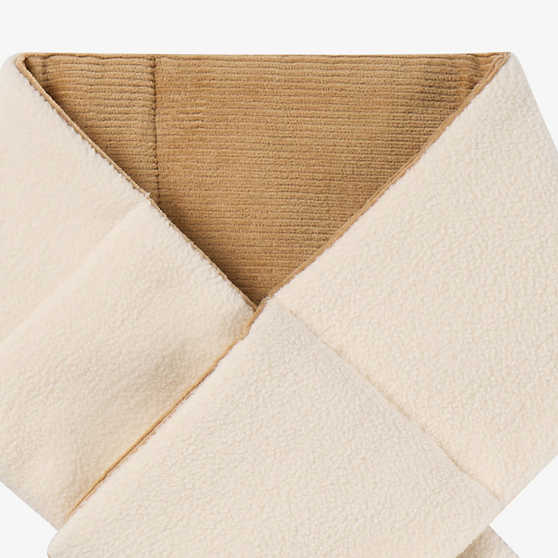 Nest Designs Cozy Croissant reversible scarf in Cloud cream, macro overlap of textured fleece face and tan ribbed underside