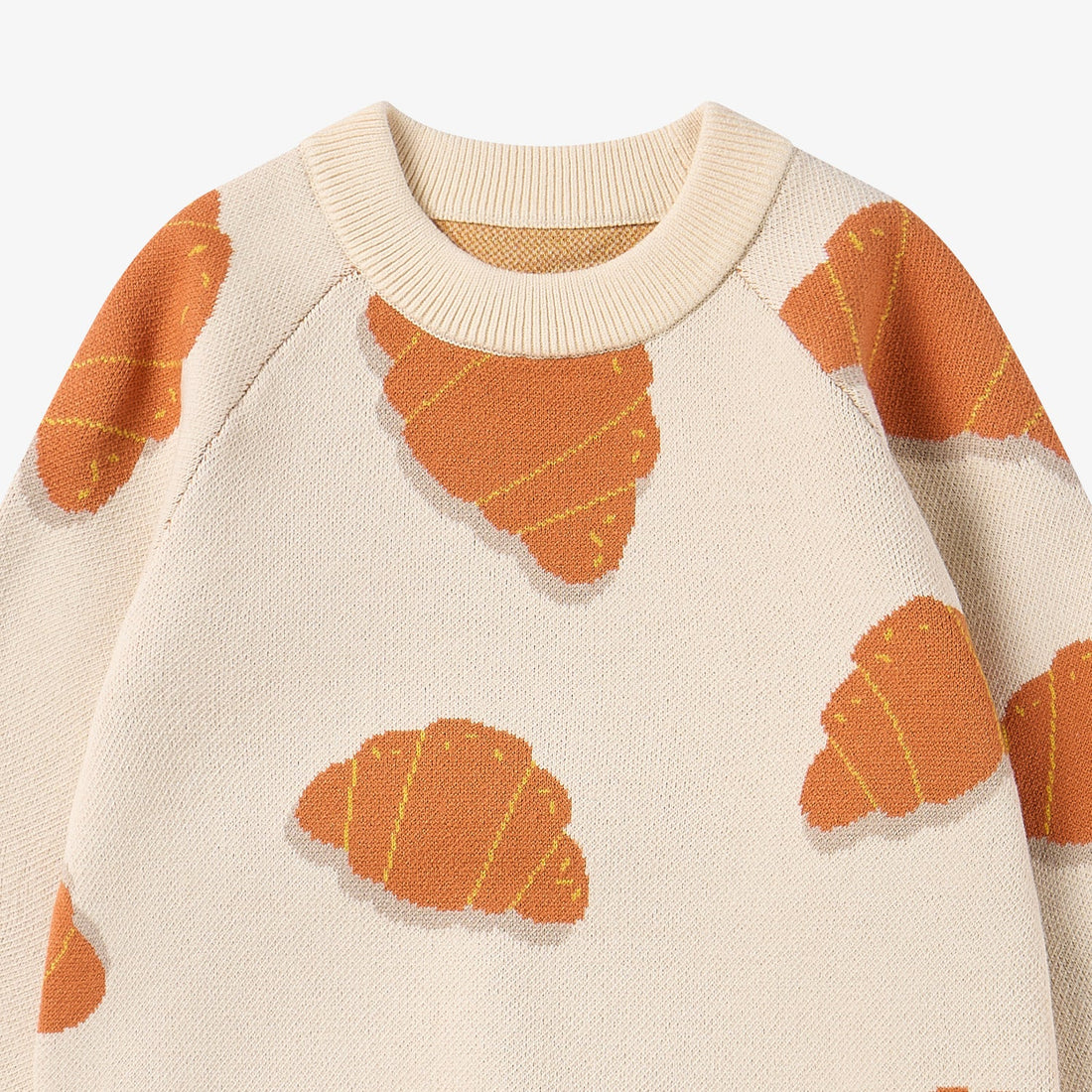 Nest Designs Cozy Croissants cream knit sweater, neckline detail with ribbed crew collar and raglan seams