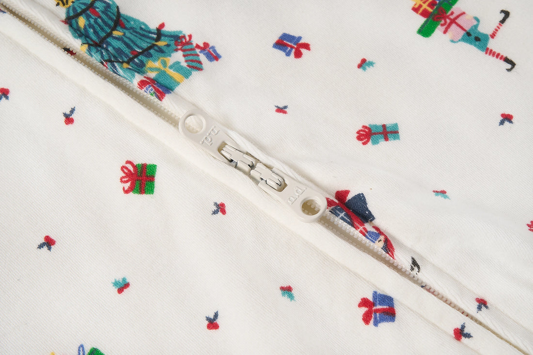 Nest Designs Santas Elves: close-up of the footed sleeper front zipper and bound edges