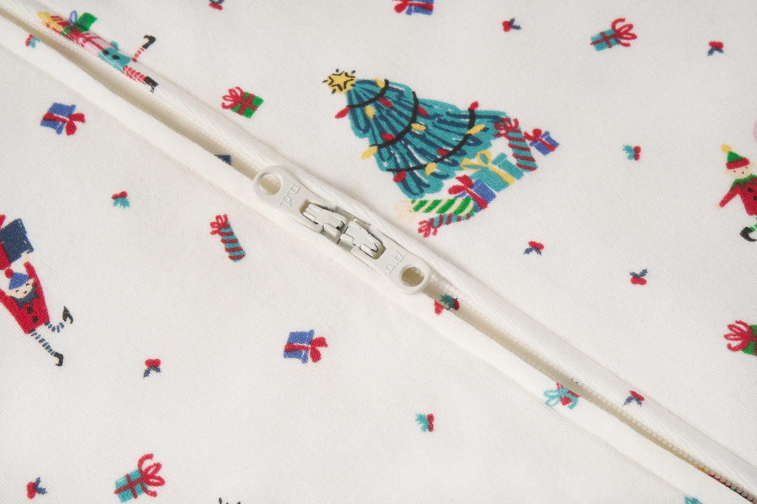 Nest Designs Santas Elves: close-up of the footless sleeper zipper slider and bound opening