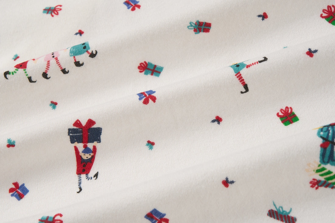 Nest Designs Santas Elves: close-up of the footless sleeper knit and Santa Elves print
