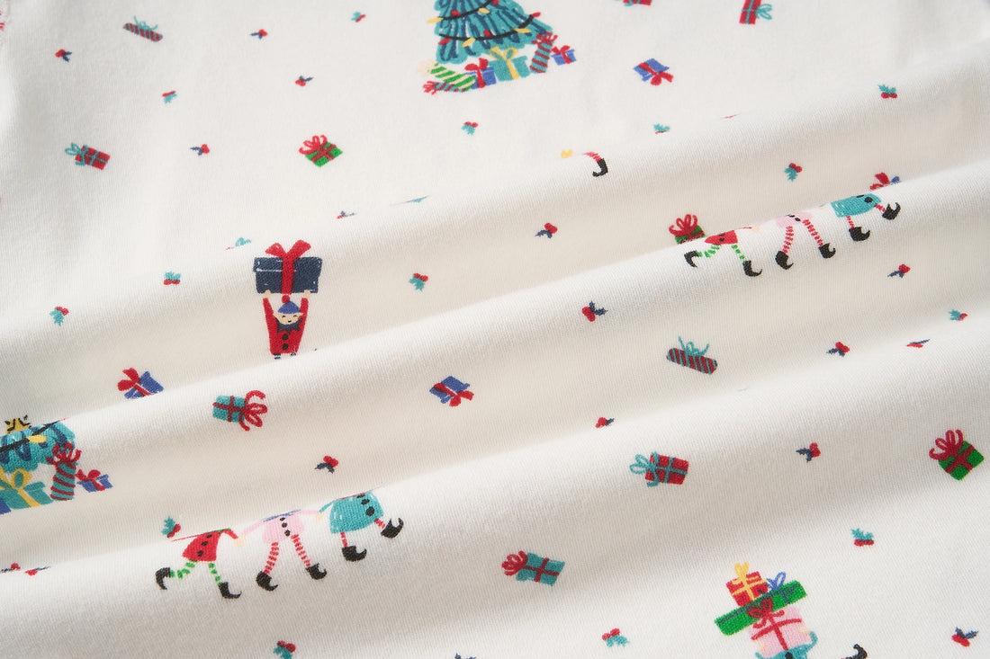 Nest Designs Santas Elves: close-up of the pajama set brushed knit and Santa Elves print