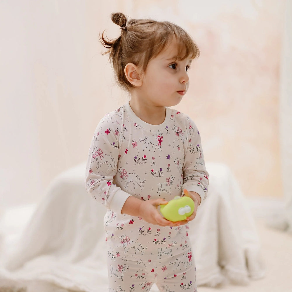 NEST DESIGNS Nest Designs Long Sleeve PJ Set Doggie Meadow Dogs with pink bows and scattered wildflower print img 1/6
