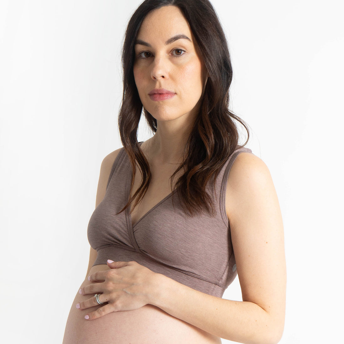 Pregnant model wearing the Nest Designs Elderberry Crossover Nursing Bra