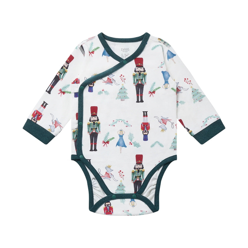 Nest Designs Organic Cotton Long Sleeve Kimono Onesie Nutcracker, white with green trim, wrap-front closure shown.