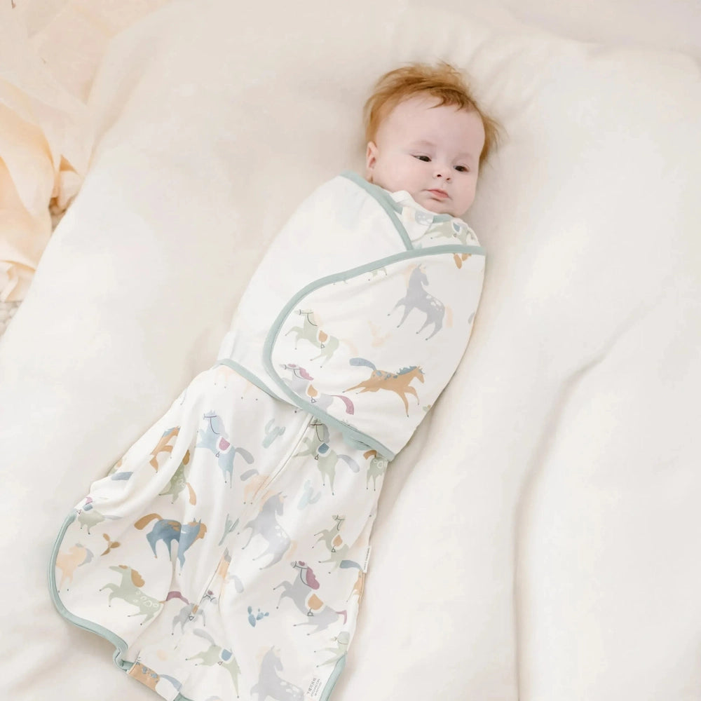 NEST DESIGNS Nest Designs Organic Cotton Swaddle Sleep Bag Pony Express envelope wrap closure with sage binding trim img 3/6