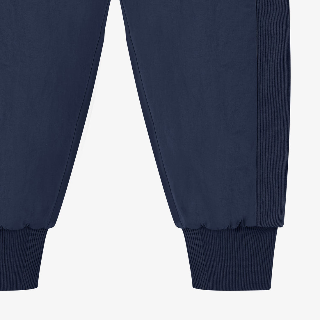 Nest Designs Nylon Pants in Blueberry navy, lower-leg detail showing gathered fabric and wide ribbed cuffs