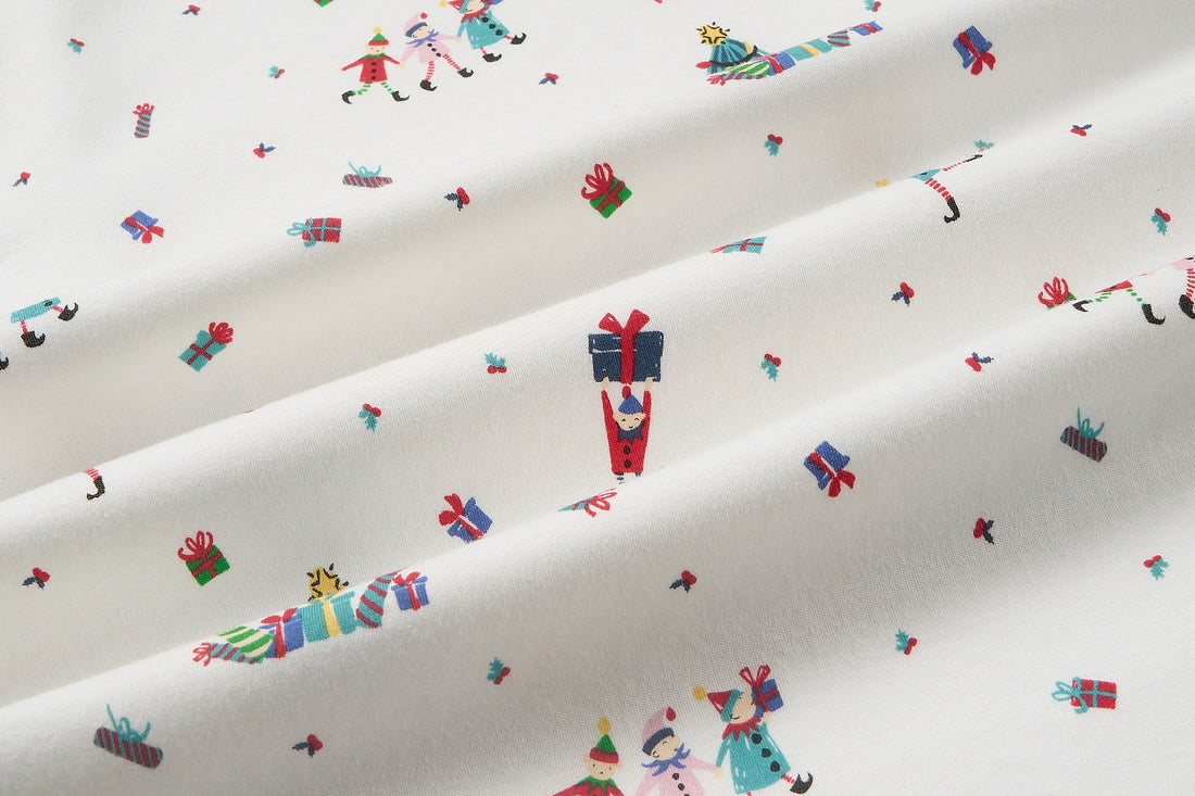 Nest Designs Santas Elves: close-up of the sleep bag organic cotton knit and Santa Elves print