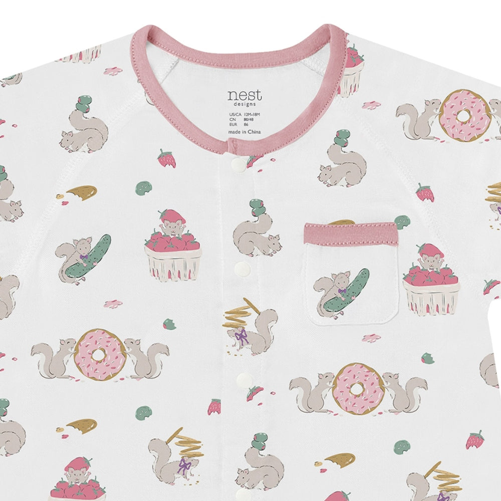 NEST DESIGNS Nest Designs Short Sleeve Romper Very Squirrelly pink contrast trim with chest pocket and food-themed print img 2/3