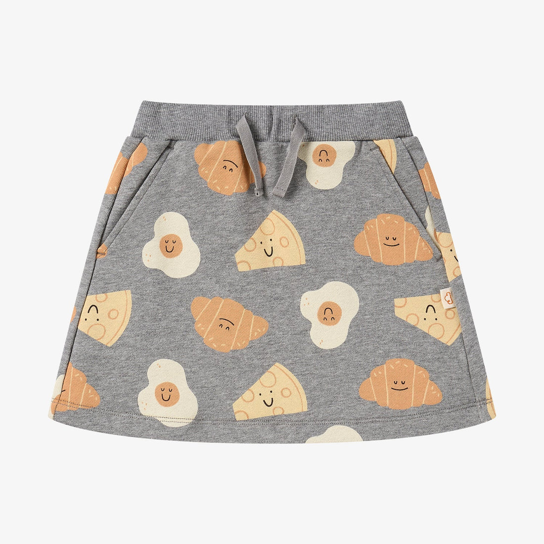 Nest Designs Smiley Side Up grey skirt, front studio view with drawstring waist, pockets, and breakfast-food print
