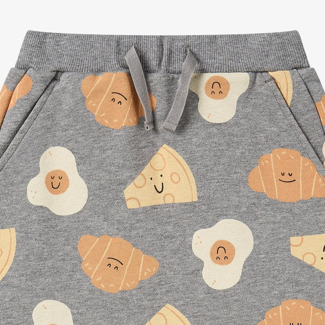Nest Designs Smiley Side Up grey skirt, upper close-up of ribbed waistband, tied drawstring, and slanted pockets