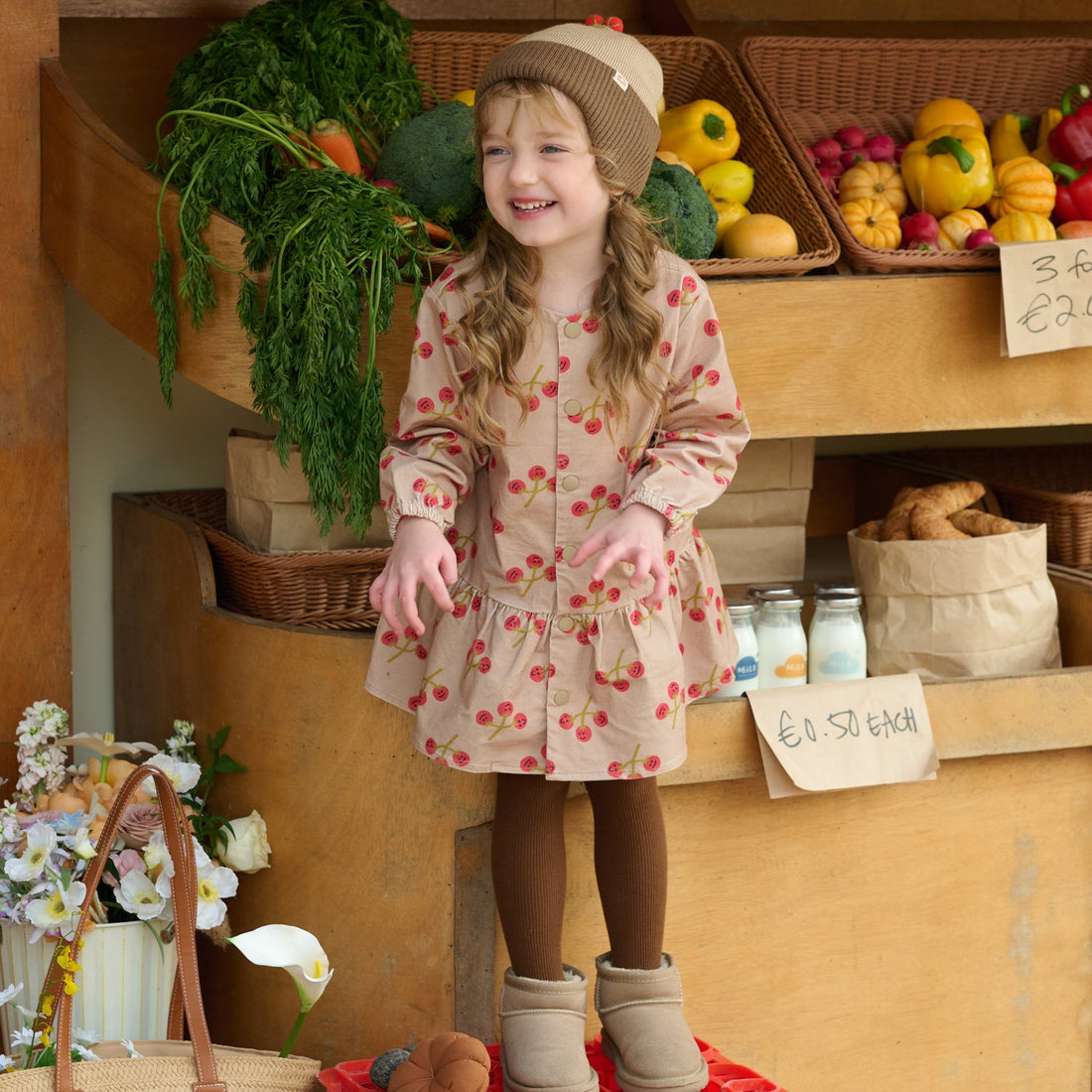 Nest Designs You're So Vine blush corduroy dress worn with a brown beret and tights at a produce market